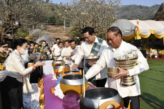 Leaders, Masses Participate in Alms Offering at Wat Phu Champassak